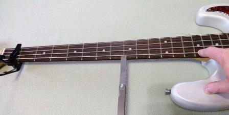 Checking neck relief on a DIY bass