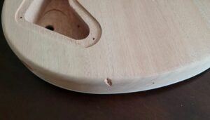 Chip in wooden guitar body