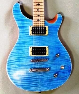 Flamed maple top on PRS-style guitar.